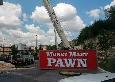 Money Mart Pawn Cabinet Sign